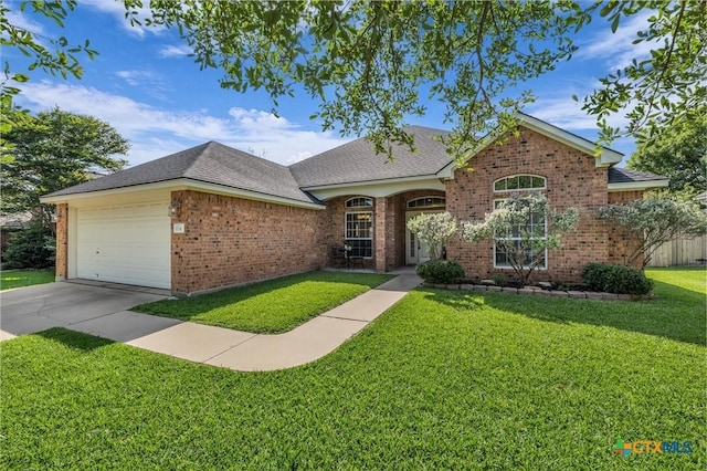 5708 High Meadow Dr, Temple, TX 76502 - view of front facade with brick siding, a front yard, an attached garage, driveway, and a shingled roof