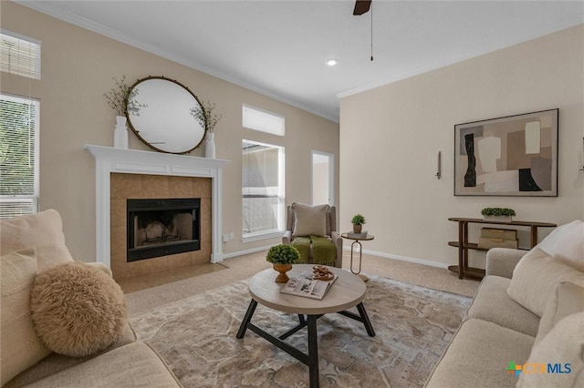 5708 High Meadow Dr, Temple, TX 76502 - living room featuring crown molding, carpet floors, healthy amount of natural light, a tile fireplace, and ceiling fan