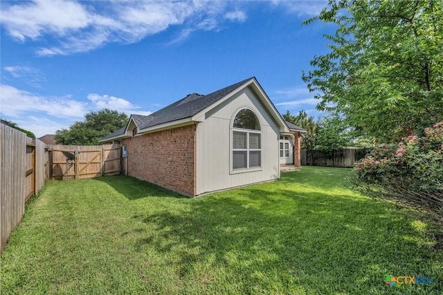 5708 High Meadow Dr, Temple, TX 76502 - view of side of home with a fenced backyard, a shingled roof, and brick siding