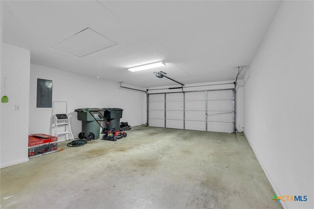5708 High Meadow Dr, Temple, TX 76502 - garage featuring electric panel and a garage door opener
