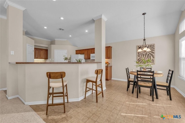 5708 High Meadow Dr, Temple, TX 76502 - kitchen featuring brown cabinetry, white appliances, a kitchen bar, crown molding, and pendant lighting