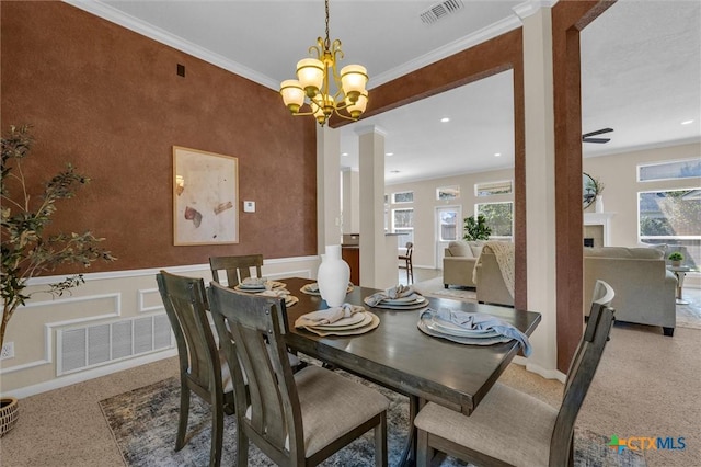 5708 High Meadow Dr, Temple, TX 76502 - dining room featuring healthy amount of natural light, wainscoting, ornamental molding, a chandelier, and a fireplace