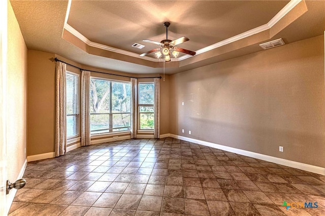243 Arendes Dr, New Braunfels, TX 78132 - spare room with a raised ceiling, ceiling fan, crown molding, and baseboards