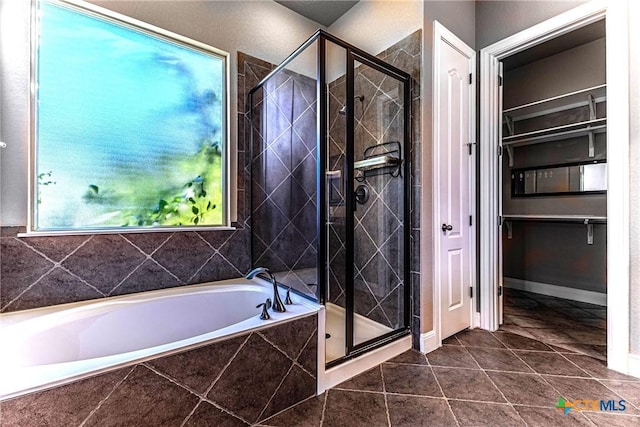243 Arendes Dr, New Braunfels, TX 78132 - full bathroom featuring a garden tub, a stall shower, and tile patterned flooring