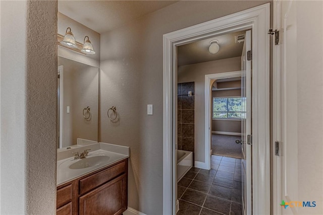 bathroom featuring tile patterned flooring and vanity