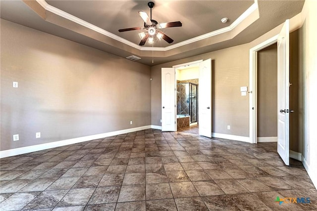 243 Arendes Dr, New Braunfels, TX 78132 - unfurnished bedroom with a tray ceiling, baseboards, crown molding, stone finish flooring, and a ceiling fan