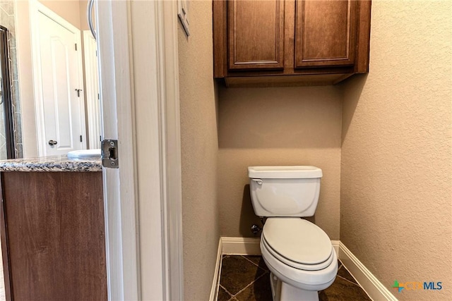 243 Arendes Dr, New Braunfels, TX 78132 - bathroom with toilet, baseboards, and tile patterned floors