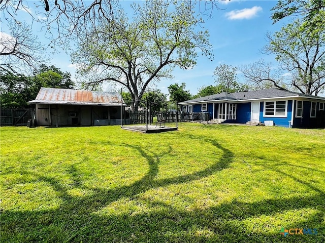 view of yard featuring a fenced backyard and a wooden deck