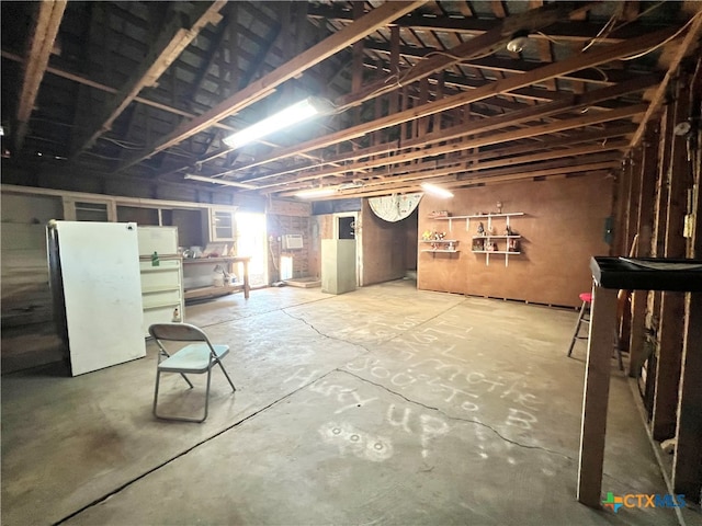 basement with white fridge