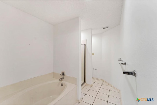 full bath with a garden tub, visible vents, a stall shower, a textured ceiling, and tile patterned floors