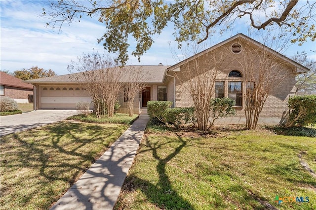 ranch-style house with a garage, driveway, brick siding, and a front yard