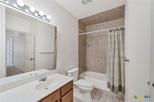 bathroom featuring vanity, visible vents, tile patterned flooring, shower / bath combination with curtain, and toilet