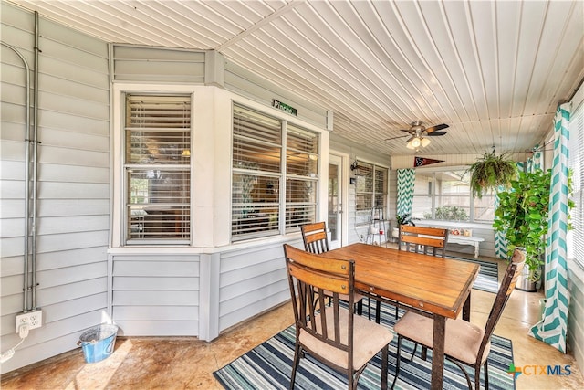 sunroom with wooden ceiling and ceiling fan