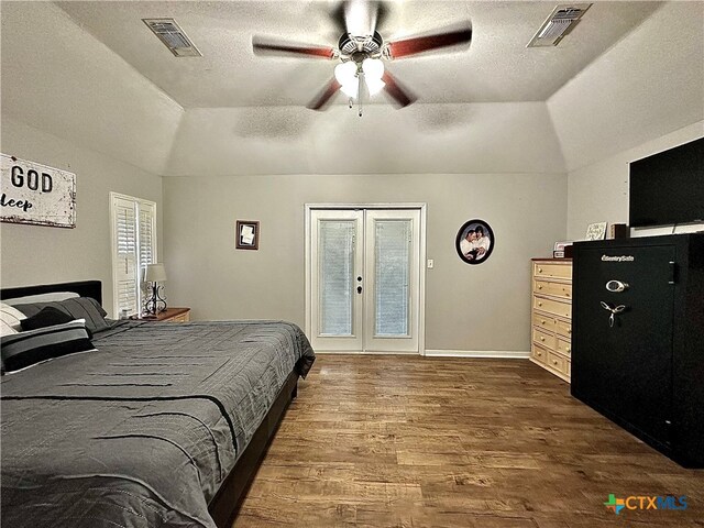 bedroom with ceiling fan, vaulted ceiling, dark wood-type flooring, french doors, and access to outside