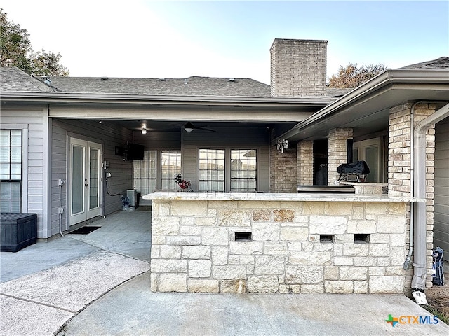 view of patio / terrace featuring french doors and ceiling fan