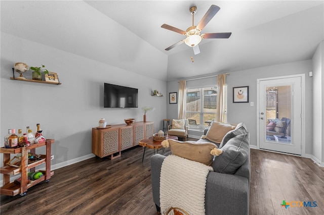 living room featuring vaulted ceiling, ceiling fan, and dark hardwood / wood-style floors