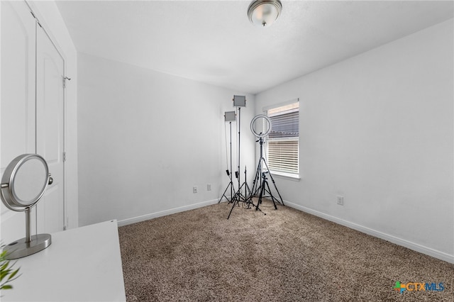 workout room featuring carpet flooring