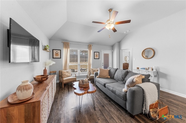 living room with ceiling fan, dark hardwood / wood-style floors, and vaulted ceiling