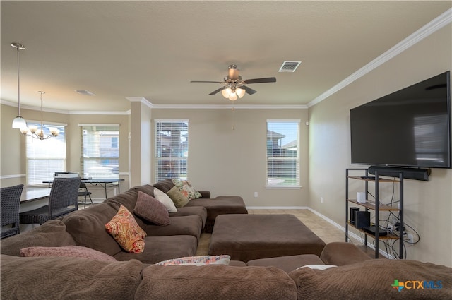 living room with ceiling fan with notable chandelier and ornamental molding