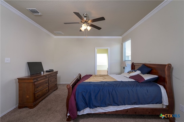 carpeted bedroom with ceiling fan and ornamental molding