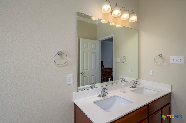 bathroom with vanity and crown molding