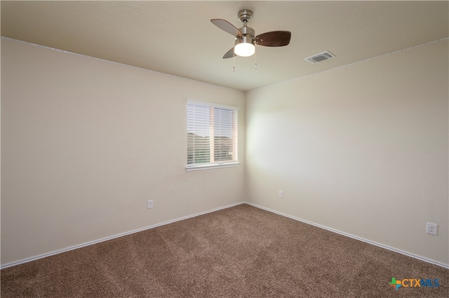 spare room featuring carpet flooring and ceiling fan