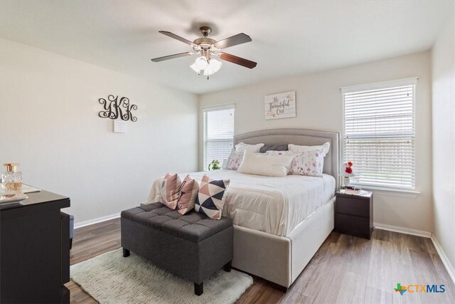 212 Nairm Ln, Temple, TX 76502 - bedroom with baseboards, wood finished floors, and ceiling fan