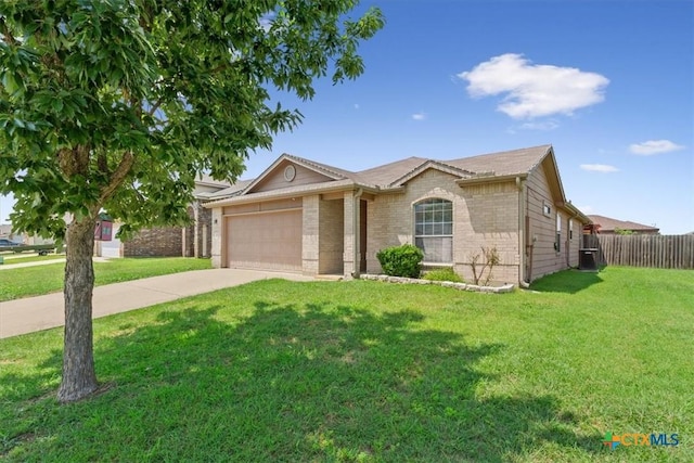 212 Nairm Ln, Temple, TX 76502 - ranch-style house with brick siding, a garage, and driveway