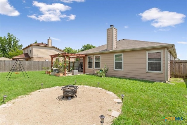 212 Nairm Ln, Temple, TX 76502 - back of property featuring a pergola, a patio, a fire pit, and a chimney
