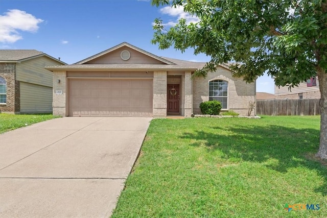 212 Nairm Ln, Temple, TX 76502 - ranch-style home featuring brick siding, an attached garage, and driveway