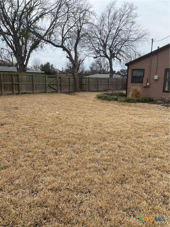 view of yard featuring fence