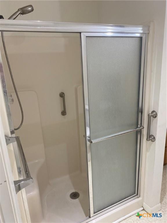 bathroom featuring a shower stall