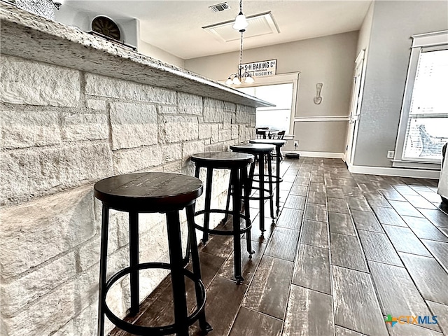 dining room with dark hardwood / wood-style flooring