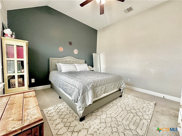 bedroom featuring ceiling fan, carpet flooring, and lofted ceiling