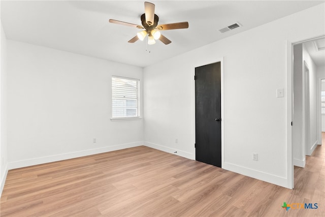 unfurnished room with ceiling fan and light hardwood / wood-style flooring