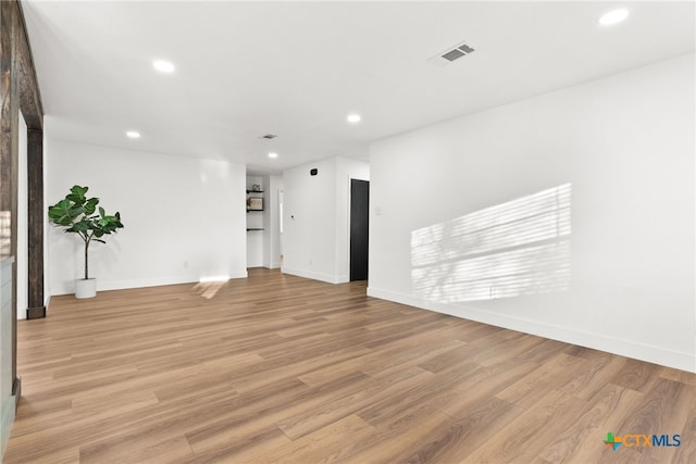 unfurnished living room featuring light wood-type flooring