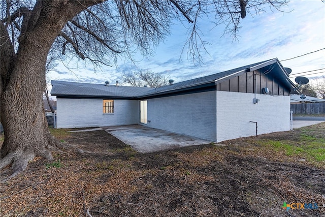 back of house with a patio