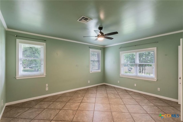 unfurnished room with a wealth of natural light, a ceiling fan, crown molding, and visible vents