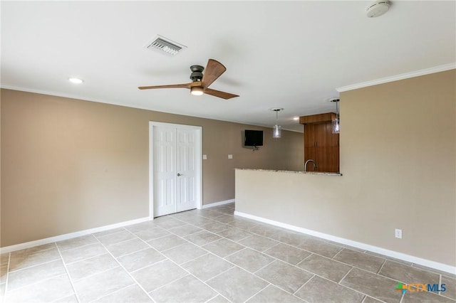 empty room featuring visible vents, ornamental molding, ceiling fan, and light tile patterned floors