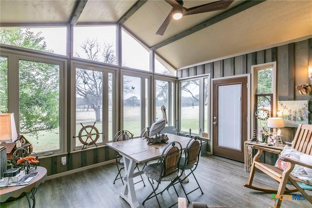 sunroom / solarium featuring ceiling fan and vaulted ceiling