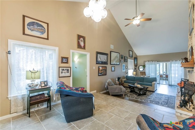 living room featuring ceiling fan and high vaulted ceiling