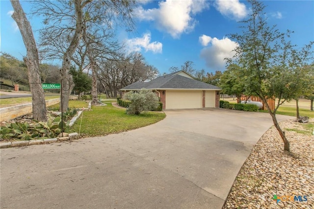 exterior space featuring a yard and a garage