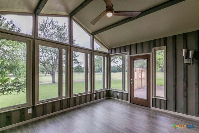 unfurnished sunroom with beamed ceiling and a ceiling fan