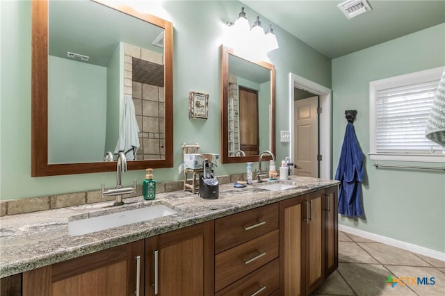 bathroom featuring tile patterned floors and vanity