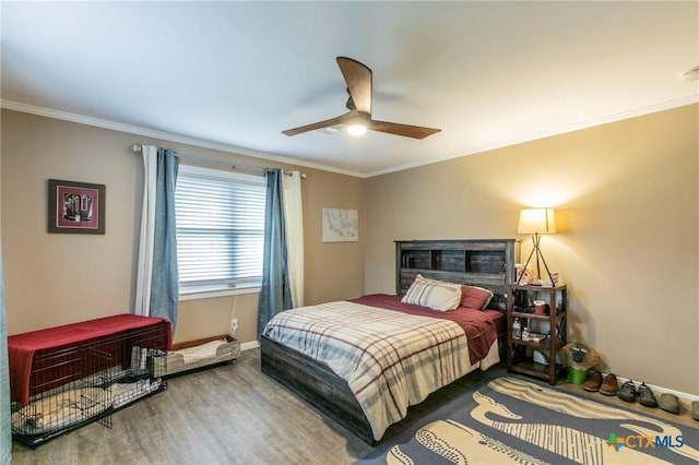 bedroom featuring wood-type flooring, ceiling fan, and crown molding