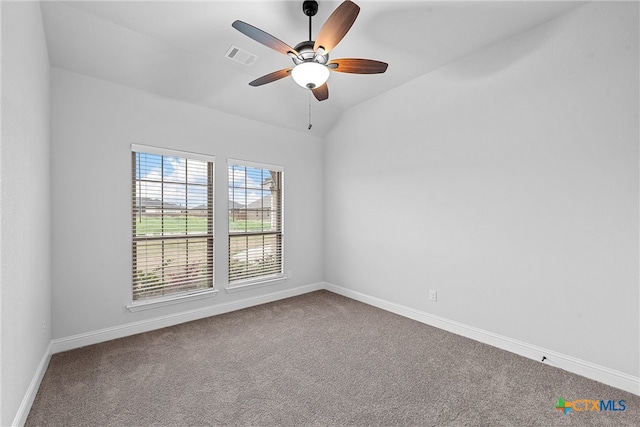 carpeted empty room with lofted ceiling and ceiling fan