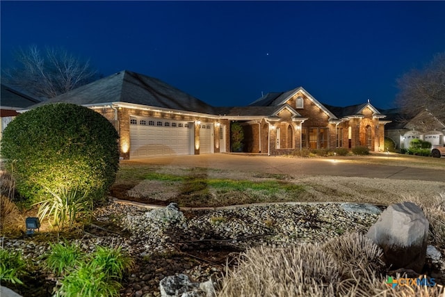 ranch-style house featuring a garage