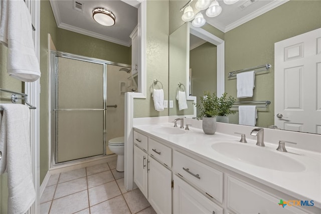 bathroom featuring an enclosed shower, vanity, ornamental molding, tile patterned floors, and toilet