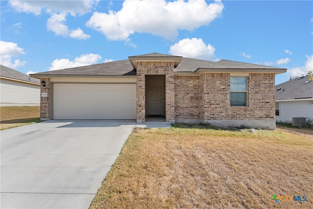4904 Karen Green Dr, Killeen, TX 76549 - view of front of house with a garage and cooling unit