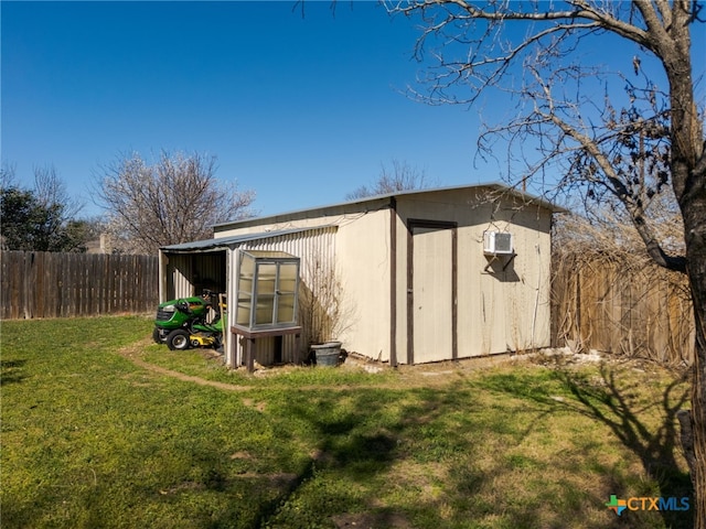 view of shed with a fenced backyard